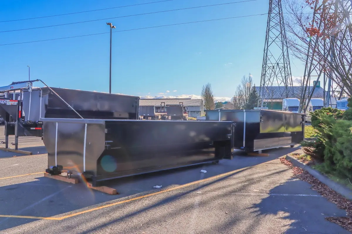 Roll-off dumpster ready for waste disposal at job site for Yard Waste Dumpster Rental in Manchester